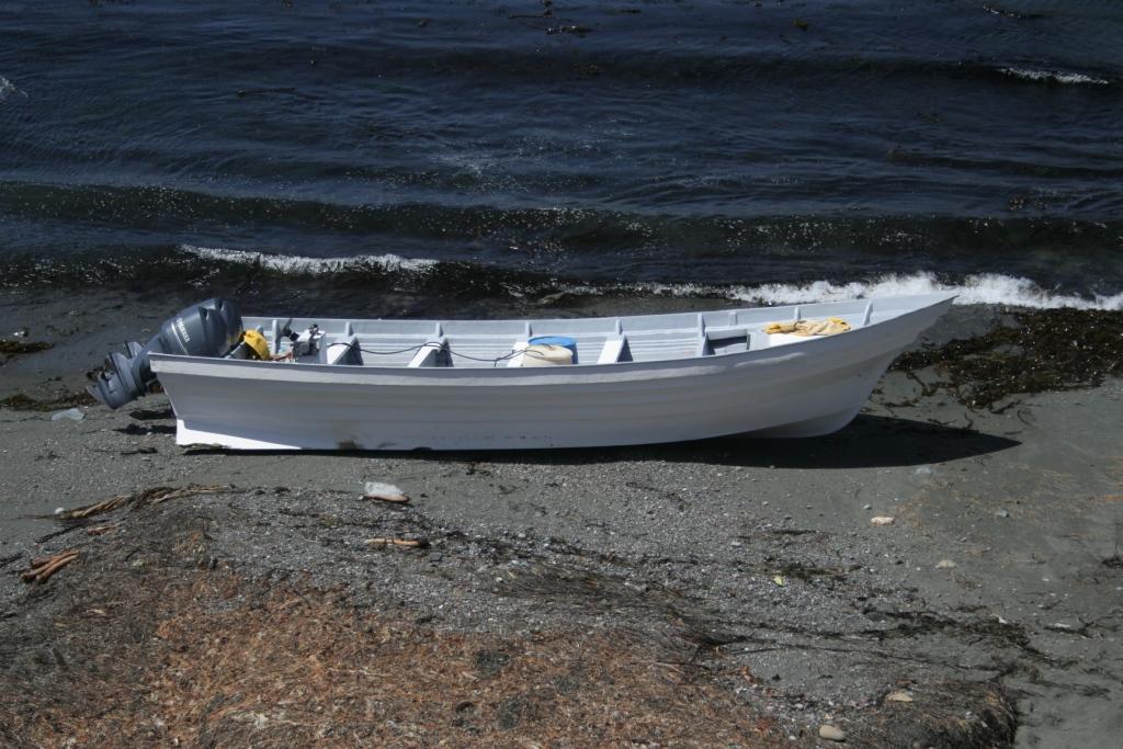 Panga boat beaches near Piedras Blancas Lighthouse