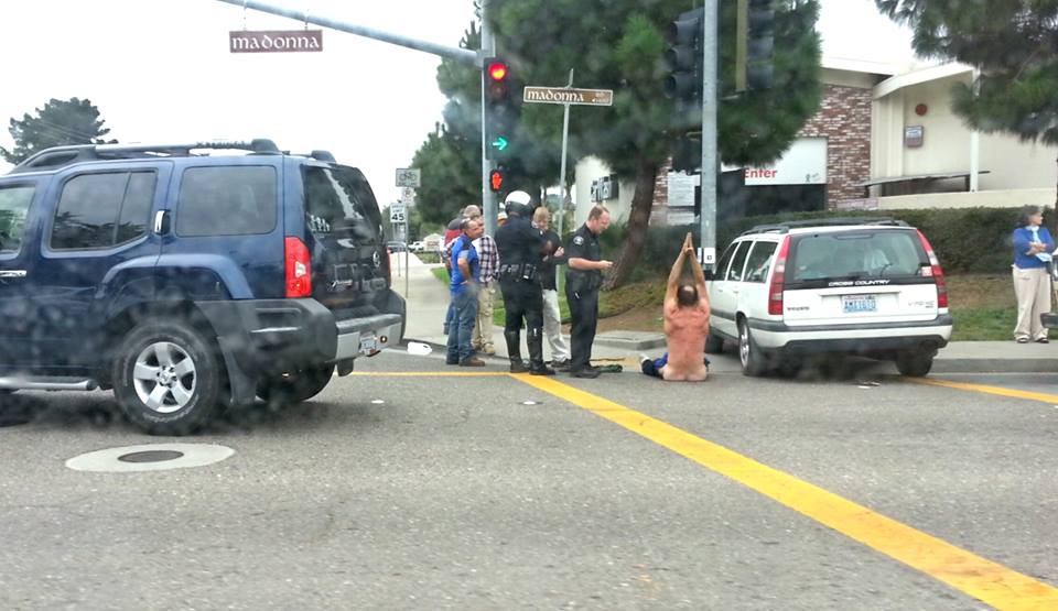 Man strips in SLO intersection after crashing car