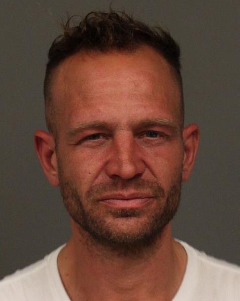 Transient smacks SLO business owner in the face