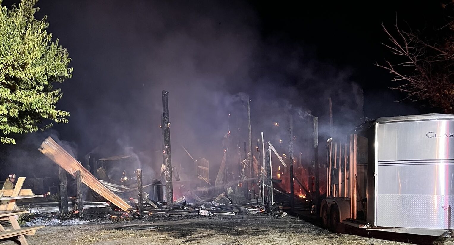 Fire burns barn, two trailers near Creston